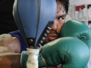 In this photo made Oct. 20, 2011, boxer Manny Pacquiao trains at the Wild Card Boxing Club in the Hollywood section of Los Angeles. Pacquiao is insulted by Juan Manuel Marquez's insistence that he won their first two fights. The pound-for-pound king is determined to leave no doubt next month. AP