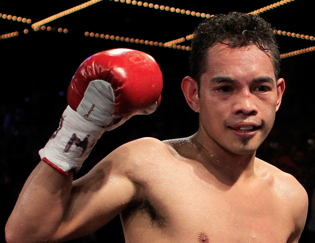 NEW YORK - OCTOBER 22: Nonito Donaire of the Philippines celebrates defeating Omar Narvaez of Argentina and defending his WBC, WBO World Bantamweight Titles at Madison Square Garden on October 22, 2011 in New York City. Chris Trotman/Getty Images/AFP