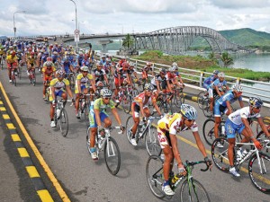 RIDERS cross the countryfs longest bridge, the San Juanico. ANDREW TADALAN