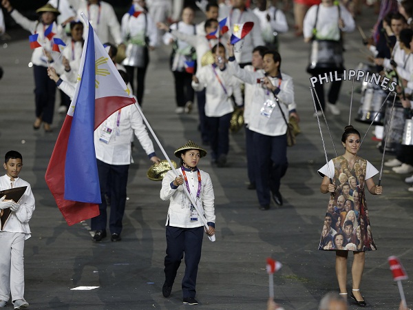 Philippines' Hidilyn Diaz carries the flag during the Opening Ceremony at the 2012 Summer Olympics, Friday, July 27, 2012, in London. AP