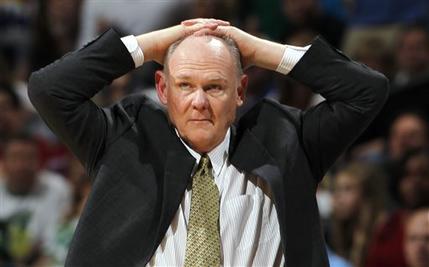 In this March 17, 2012 file photo, Denver Nuggets coach George Karl puts his hands on his head during an NBA game against the Boston Celtics in Denver. Karl is out as coach of the Nuggets. Team President Josh Kroenke confirmed in an email to The Associated Press on Thursday, June 6, 2013 that Karl's tenure was over just weeks after he was named the NBA's coach of the year. (AP Photo/David Zalubowsk, Filei)