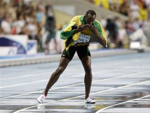 Jamaica's Usain Bolt celebrates winning gold in the Men's 100-meter final at the World Athletics Championships in the Luzhniki stadium in Moscow, Russia, Sunday, Aug. 11, 2013. AP