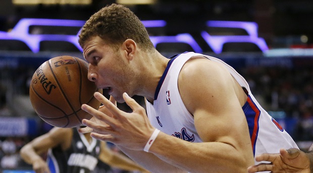 Los Angeles Clippers' Blake Griffin eyes the ball before dunking against the Orlando Magic during the second half of an NBA basketball game in Los Angeles, Monday, Jan. 6, 2014. AP