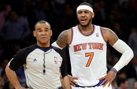 New York Knicks' Carmelo Anthony (7) argues a call with referee Dan Crawford (43) during the second half of an NBA basketball game, Wednesday, Feb. 5, 2014, in New York. The Trail Blazers won the game 94-90. AP