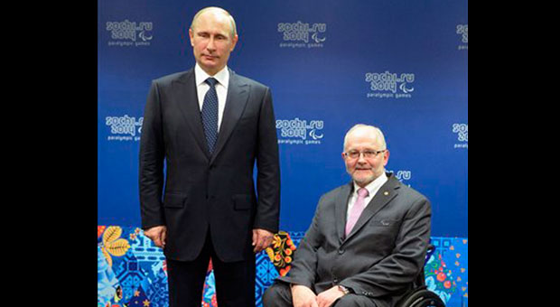 Russian President Vladimir Putin, left, and International Paralympic Committee President Philip Craven pose at a meeting with International Paralympic Committee board members and honorary council members before the opening ceremony of the 2014 Winter Paralympics in Sochi, Russia, Friday, March 7, 2014. AP