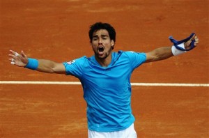 Italy's Fabio Fognini celebrates after beating Britain's Andy Murray during a Davis Cup World Group quarterfinal tennis match in Naples, Italy, Sunday, April 6, 2014. Fognini won 6-3, 6-3, 6-4.  AP