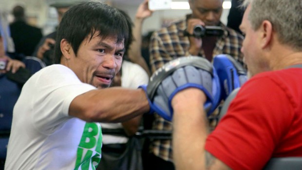 Manny Pacquiao,  with coach Freddie Roach. AP FILE PHOTO