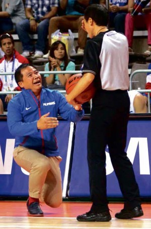 MERCURIAL Gilas Pilipinas head coach Chot Reyes courts a technical foul as he pleads for fairness with the referee. NIÑO JESUS ORBETA