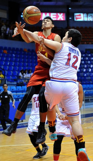 JOVIT dela Cruz of San Sebastian attacks the basket and draws a foul from Jozhua General of EAC in yesterday’s game at Filoil Flying V Arena. AUGUST DELA CRUZ