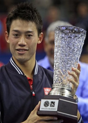 Kei Nishikori of Japan poses with his trophy after defeating Julien Benneteau of France in their final match at the Malaysian Open tennis tournament in Kuala Lumpur, Malaysia, Sunday, Sept. 28, 2014. AP 