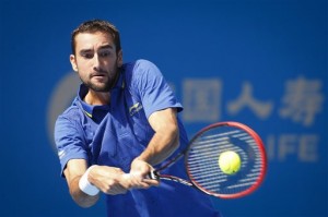 Croatia's Marin Cilic returns a shot to China's Yan Bai during their first round of China Open tennis tournament at the National Tennis Stadium in Beijing, China, Monday, Sept. 29, 2014. —VINCENT THIAN/AP 