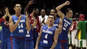 Philippines' Japeth Aguilar, left, and teammate Jim Alapag, right, celebrates after winning the match at the end of the match  against Senegal during the Group B Basketball World Cup match between the Philippines and Senegal in Seville, Spain, Thursday, Sept. 4, 2014. The 2014 Basketball World Cup competition will take place in various cities in Spain from Aug. 30 through to Sept. 14. AP