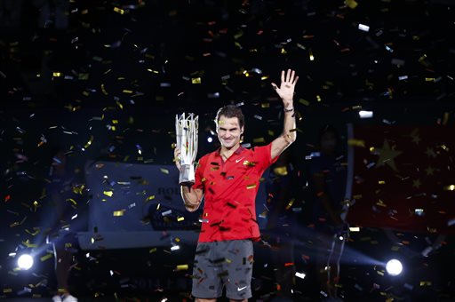 Roger Federer of Switzerland holds the trophy during awards ceremony after the men's singles final against Gilles Simon of France at the Shanghai Masters Tennis Tournament in Shanghai, China, Sunday, Oct. 12, 2014.  AP 