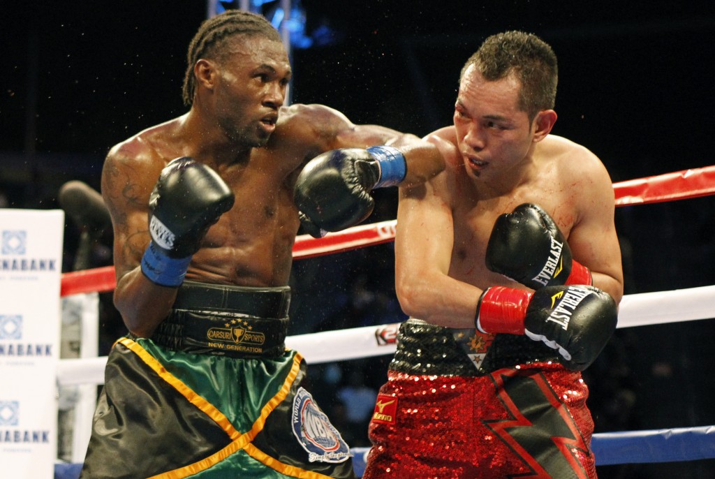 Nicholas Walters, left, battles Nonito Donaire in the second round during a WBA featherweight title boxing fight, Saturday, Oct. 18, 2014, in Carson, Calif. Walters won in the sixth round. AP