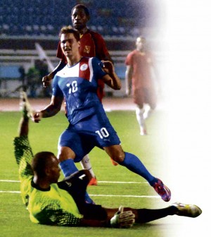 PHIL Younghusband scores off Papua New Guinea goalkeeper Albert Mesulam. It was his 38th goal in 63 games for the Azkals. ARNOLD ALMACEN