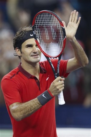 Roger Federer of Switzerland reacts after wining match against Julien Benneteau of France during their men's singles quarterfinal match of Shanghai Masters Tennis Tournament in Shanghai, China, Friday, Oct. 10, 2014. AP