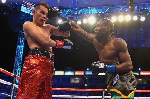 Nicholas Walters of Jamaica Nonito Donaire throws a punch against Nonito Donaire during the WBA "Super" Featherweight Title bout at StubHub Center on October 18, 2014 in Los Angeles, California.  AP