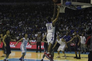 Alfred Aroga of NU Bulldogs rebounds the ball against Gideon Bailonia of Ateneo de Manila University. Bulldogs advance to the finals as they beat Eagles 65-63. Noy Morcoso lll