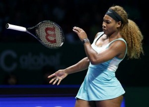 Serena Williams of the U.S. bounces her racket during her semifinal match against Denmark's Caroline Wozniacki at the WTA tennis finals in Singapore, Saturday, Oct. 25, 2014. AP.