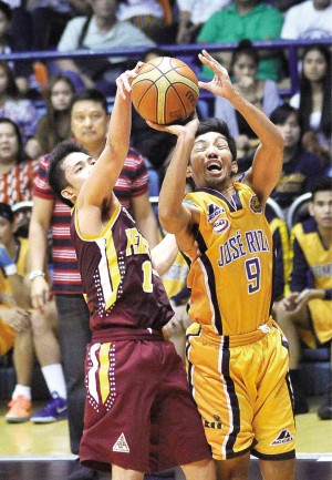 PERPETUAL’S Juneric Baloria (left) shows the defensive side of his game, thwarting a shot by Philip Paniamogan of JRU. AUGUST DELA CRUZ