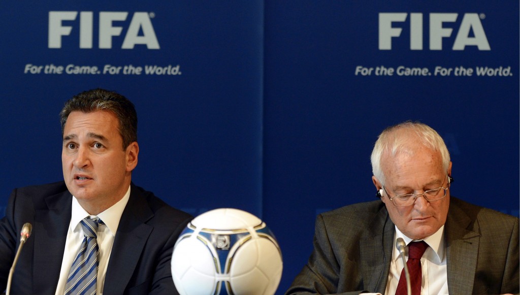 In this Friday, July 27, 2012 file photo, Chairmen of the two chambers of the new FIFA Ethics Committee Michael Garcia, left, from the US and Joachim Eckert, right, from Germany attend a press conference, at the Home of FIFA in Zurich, Switzerland. AP 
