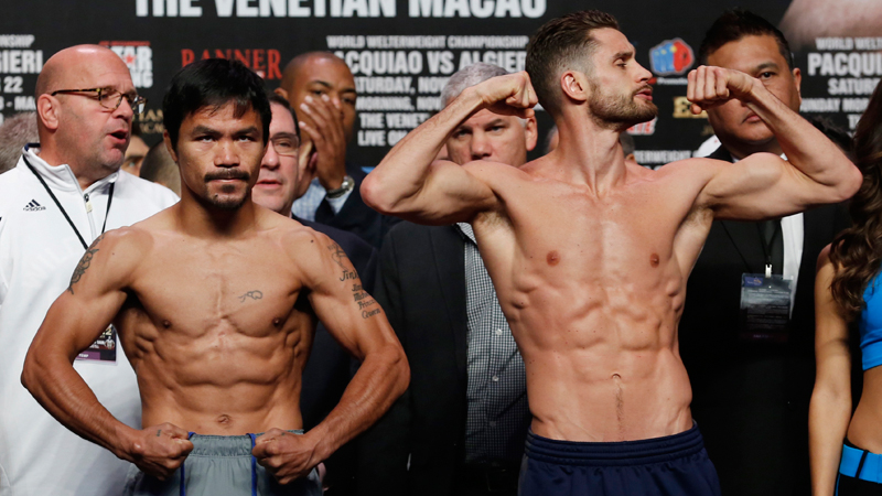 WBO welterweight champion Manny Pacquiao, left, of the Philippines and WBO junior welterweight champion Chris Algieri of the United States pose for photos during the weigh-in for their welterweight title fight at the Venetian Macao in Macau, Saturday, Nov. 22, 2014. Pacquiao and Algieri are scheduled to fight in their WBO welterweight boxing match at the casino on Nov. 23. (AP Photo/Kin Cheung)