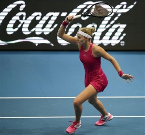 Kristina Mladenovic of the UAE Royals returns a shot during her women's singles match against Daniela Hantuchova of the Singapore Slammers in the International Premier Tennis League at the Mall of Asia Arena in Pasay city, south of Manila, Philippines, Saturday, Nov. 29, 2014.  AP