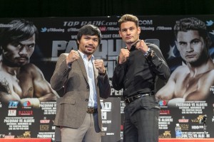  In this Sept. 3, 2014, file photo, boxers Manny Pacquiao, left, and Chris Algieri pose for a photo in Los Angeles. AP