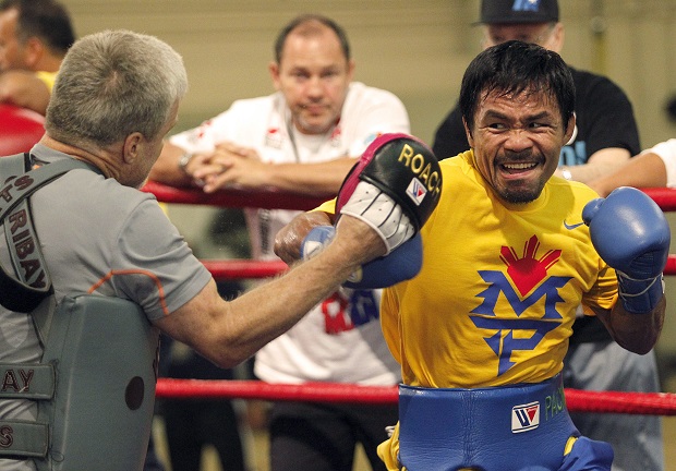 DEADLY FORM Boxing champion and Sarangani Rep.Manny Pacquiao trains at the Cotai Arena gym in The Venetian Macao resort and casino with longtime coach Freddie Roach. AP