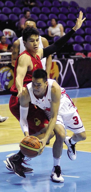 FORWARD JC Intal and the Barako Bull Energy (left) send Cyrus Baguio and the Alaska Aces crashing to their first loss in the PBA Philippine Cup during last night’s game. AUGUST DELA CRUZ