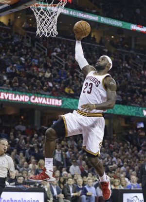 Cleveland Cavaliers' LeBron James drives to the basket against the Orlando Magic during the first quarter of an NBA basketball game Monday, Nov. 24, 2014, in Cleveland. AP