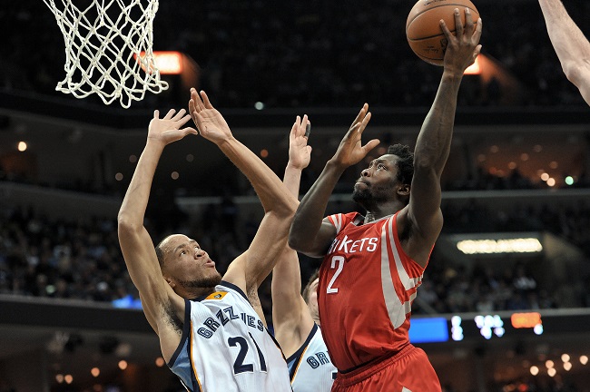 Houston Rockets guard Patrick Beverley (2) shoots against Memphis Grizzlies forward Tayshaun Prince (21) during the first half of an NBA basketball game Friday, Dec. 26, 2014, in Memphis, Tenn. AP