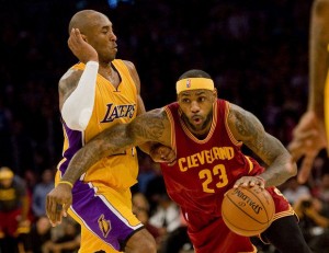Cleveland Cavaliers’ LeBron James tries to dribble past Los Angeles Lakers’ Kobe Bryant during their game at Staples Center on Friday (Manila time). AP