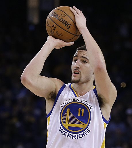 Golden State Warriors' Klay Thompson shoots during the third quarter of an NBA basketball game against the Sacramento Kings on Friday, Jan. 23, 2015, in Oakland, Calif. (AP Photo/Ben Margot)