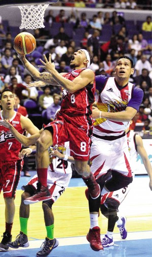 BEST Player of the Conference June Mar Fajardo (right) of San Miguel Beer fails to stop Calvin Abueva of Alaska from scoring in Wednesday’s Game 4 of the title series at Smart Araneta Coliseum. AUGUST DELA CRUZ