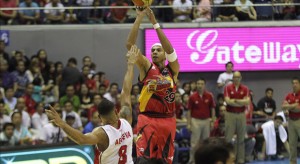 San Miguel Beer's Arwind Santos shoots a 3-pointer over Alaska's Calvin Abueva in Game 1 of the 2015 PBA Philippine Cup Finals. Santos made the go-ahead triple over Abueva in the waning seconds of Game 7.  PBA IMAGE/NUKI SABIO