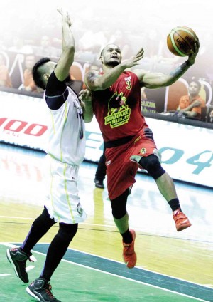 BARAKO Bull’s Sol Mercado soars for a layup against Blackwater’s Bryan Faundo in yesterday’s game.  RICHARD A. REYES 