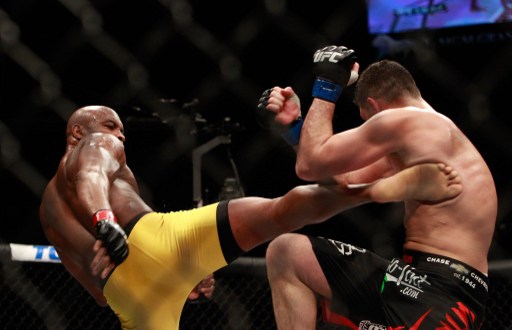 Anderson Silva (L) kicks Nick Diaz in their middleweight bout during UFC 183 at the MGM Grand Garden Arena on January 31, 2015 in Las Vegas, Nevada. Silva won by unanimous decision.  AFP