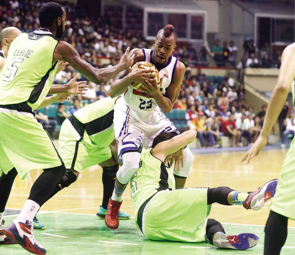 GLOBALPORT’S Calvin Leslie, Stanley Pringle and Anthony Semerad (from left) gang up on the prolific Marqus Blakely (23) of Purefoods in the game the Star Hotshots won, 83-70, last Friday at Cuneta Astrodome.  EDWIN BACASMAS
