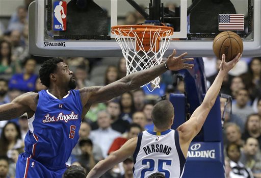Los Angeles Clippers center DeAndre Jordan (6) defends the basket against Dallas Mavericks forward Chandler Parsons (25) during the first half of an NBA basketball game Monday, Feb. 9, 2015, in Dallas. The Clippers won 115-98. Jordan had 22 points and a career-high 27 rebounds. (AP Photo/LM Otero)