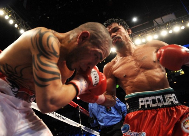 Manny Pacquiao of the Philippines (R) punches Miguel Cotto of Puerto Rico during their WBO welterweight title fight on November 14, 2009 at the MGM Grand in Las Vegas, Nevada.