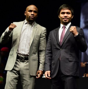 Boxers Manny Pacquiao (R) from the Philippines and Floyd Mayweather from the US pose during a press conference on March 11, 2015 in Los Angeles, California, to launch the countdown to their May 2, 2015 super-fight in Las Vegas. AFP PHOTO/ FREDERIC J. BROWN