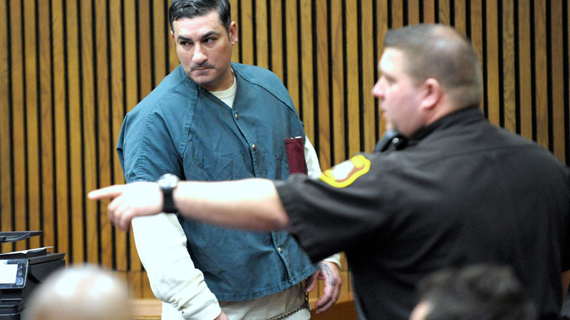 A Wayne County deputy directs Bassel Saad, left, into the courtroom of Wayne County Circuit Court Judge Thomas Cameron on Friday, March 13, 2015 in Detroit. Saad was sentenced to at least eight years in prison for a punch that killed John Bieniewicz, a Detroit-area referee. (AP Photo/Detroit News, Todd McInturf) 