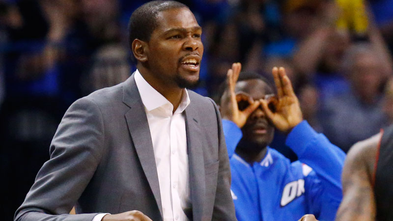 Injured Oklahoma City Thunder forward Kevin Durant reacts on the bench to a basket in the fourth quarter of an NBA basketball game against the Toronto Raptors in Oklahoma City, Sunday, March 8, 2015. Oklahoma City won 108-104. (AP Photo/Sue Ogrocki)