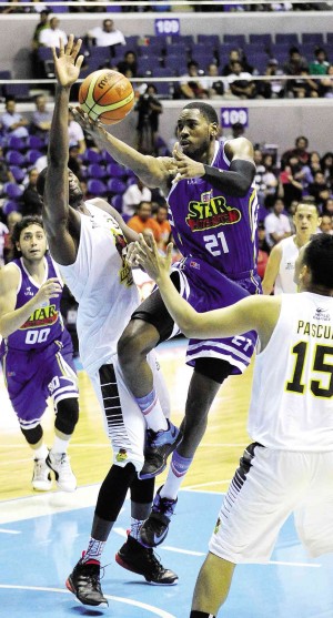 DENZEL Bowles (No. 21) attacks the Barako Bull defense on the way to the hoop. Bowles will spearhead Purefoods’ bid today.  AUGUST DELA CRUZ