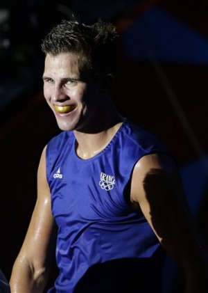 In this Aug. 3, 2012 file photo, France's Alexis Vastine smiles as he exits the ring after defeating Mongolia's Tuvshinbat Byamba in a men's welterweight 69-kg preliminary boxing match at the 2012 Summer Olympics in London. Two helicopters carrying passengers filming the popular European reality show "Dropped" crashed Monday, March 9, 2015 in a remote area of northwest Argentina, killing all passengers on board including Vastine, according to Argentine authorities. AP
