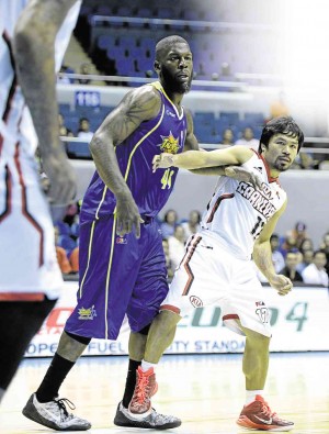 MANNY Pacquiao of KIA and Talk ‘N Text import Ivan Johnson jockey for position during their recent PBA match won by the Carnival, 106-103.   AFP