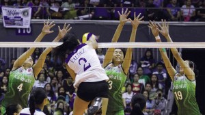 ATENEO’S Alyssa Valdez (No. 2) cracks the La Salle wall of (from left) Carol Ann Cerveza, Mika Reyes and Christine Soyud during Game 1 of their championship series last night.  ALEXIS CORPUZ