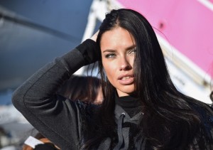 NEW YORK, NY - NOVEMBER 30: Victoria's Secret Model Adriana Lima departs for London for the 2014 Victoria's Secret Fashion Show at JFK Airport on November 30, 2014 in New York City. Mike Coppola/Getty Images for Victoria's Secret/AFP 