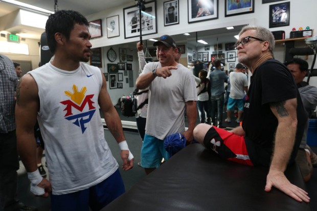 Manny Pacquiao talks to his trainer Freddie Roach and strength and conditioning coach Justine Fortune inside the Wild Card gym after his training on Thursday, 23 April 205. PHOTO BY REM ZAMORA